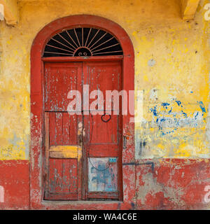 Vintage wooden door in the historic city center of Panama City, also known as Casco Antiguo and Casco Viajo or Old Quarter, Panama. Stock Photo