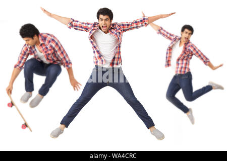 Multiple images of a young man jumping in mid air Stock Photo