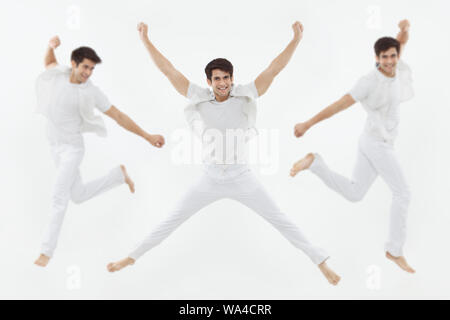 Multiple images of a young man jumping in mid air Stock Photo