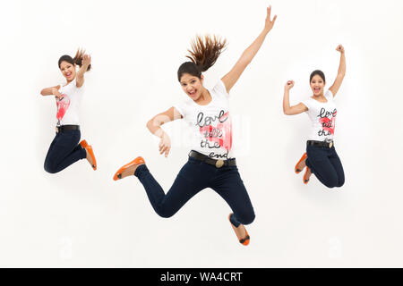 Multiple images of a young woman jumping in air Stock Photo