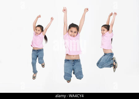 Multiple images of a girl jumping in air and smiling Stock Photo - Alamy