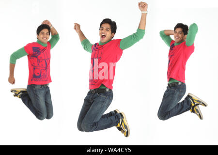 Multiple images of a young man jumping in mid air Stock Photo