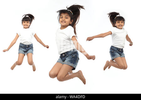 Multiple images of a girl jumping in air and smiling Stock Photo - Alamy