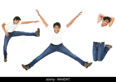 Multiple images of a young man jumping in air and smiling Stock Photo