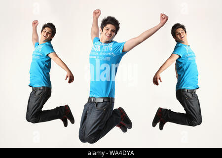 Multiple images of a young man jumping in mid air Stock Photo