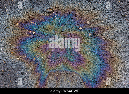 Oil stain on Asphalt, color Gasoline fuel spots on Asphalt Road as Texture or Background Stock Photo