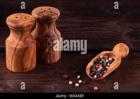 https://l450v.alamy.com/450v/wa4xbf/small-wooden-spoon-for-spices-with-pepper-low-key-olive-wood-rustic-wa4xbf.jpg