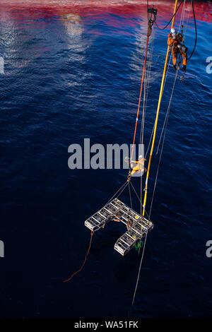 working at height above the sea in the oil and gas industry Stock Photo