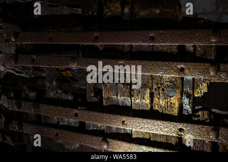 old wooden door with iron reinforcements Stock Photo