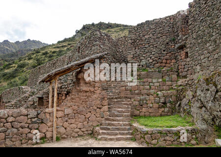 Inca ruins in Pisac archeological site surrounded by green Andes mountains, Sacred valley of the Incas, Peru, South America Stock Photo