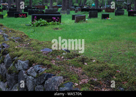 Moss covered cemetery wall in Järvenpää, Finland Stock Photo