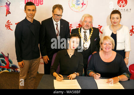 Edinburgh,Scotland, UK. 17th August 2019. Pictured L to R foreground, Bo Ye, Professor of Dance, Beijing Normal University, School of Art and Communications and Robina Gordon Addison, MBE DL UKAPTD, Principal of the Gordon School of Dancing, sign a Memorandum of Understanding to share culture between Beijing and Edinburgh. Credit: Brian Wilson/Alamy Live News. Stock Photo