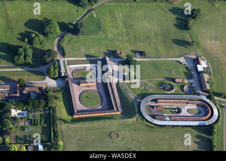 Ariel view of a horse training establishment near Lambourne on the Berkshire Downs on a late sunny day with all the horses locked up for the night. Stock Photo