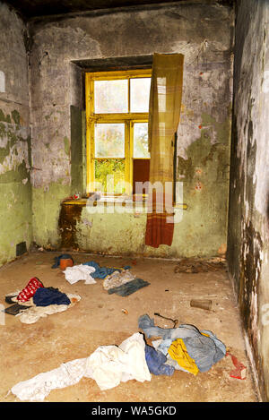 dirty room with tatters in abonded house Stock Photo