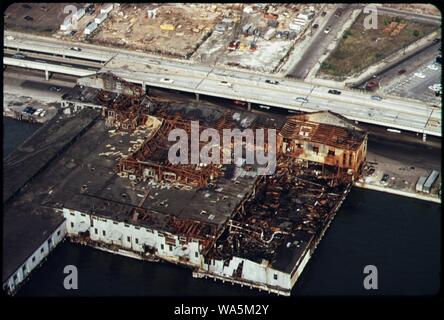 DISUSE AND AGE ROT OLD WAREHOUSES AND SHIP TERMINALS ON THE HUDSON RIVER. ALONGSIDE IS THE WEST SIDE HIGHWAY, A MAJOR MANHATTAN TRAFFIC ARTERY. Stock Photo