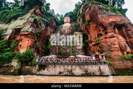 Wide angle view of Leshan Giant Buddha or Dafo from river boat in Leshan Sichuan China Stock Photo