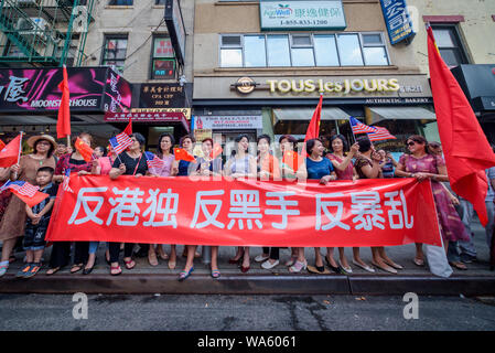 An equally strong counterprotest calling for ONE CHINA was held right across the street. - Hundreds joined activist group New Yorkers Supporting Hong Kong (NY4HK) at a rally on August 17, 2019 at Confucius Plaza, in Chinatown followed by a march to Manhattan Bridge Small Park, to show support for Hong Kong's ongoing pro democracy struggle. This was timed to coincide with the ‘Civil Human Rights Front' rally in Victoria Park Hong Kong as well as three other planned protests taking place in Hong Kong this weekend. (Photo by Erik McGregor/Pacific Press) Stock Photo