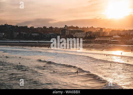 Warm sunset over Bondi Beach on a cold winter afternoon. Stock Photo