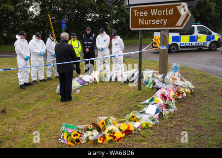Police officers stand in silence at the scene where Thames Valley Police officer Pc Andrew Harper, 28, died following a 'serious incident' at about 11.30pm on Thursday near the A4 Bath Road, between Reading and Newbury, at the village of Sulhamstead in Berkshire. Stock Photo