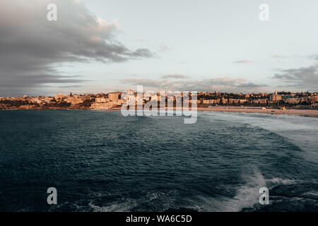 The first rays of morning sun hit the South Bondi Headland on a cold winter morning.