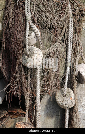old fishing nets with cork floats attached Stock Photo - Alamy