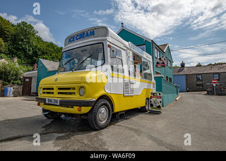 Fishguard, Wales, UK - Aug 12, 2019: Yellow and white food truck in the old port of Fishguard Stock Photo