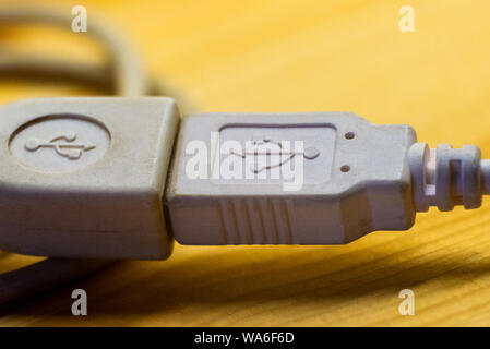 Two white USB socket port on wire with USB sign. Stock Photo