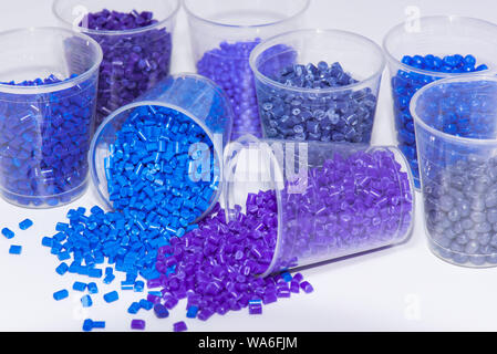 some blue and violet dyed thermoplastic resin on white background Stock Photo