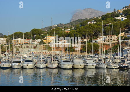 Sailing boats moored in the marina, early morning view with Montgo mountain in the background, Javea, Alicante Province, Valencia, Spain Stock Photo