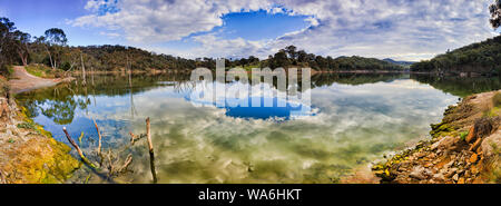 Scenic Lake Lyell on Coxs river above hydro electric dam in Blue Mountains of Australia on a sunny day with clouds reflecting in still waters - perfec Stock Photo