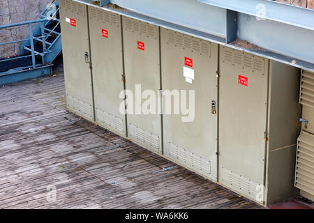 Electricity power transformer substation boxes aligned in an outdoor facility Stock Photo