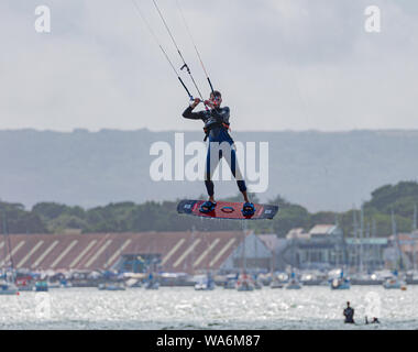 Kite Surfers, Wind Surfers on a windy day in Poole Dorset UK Stock Photo