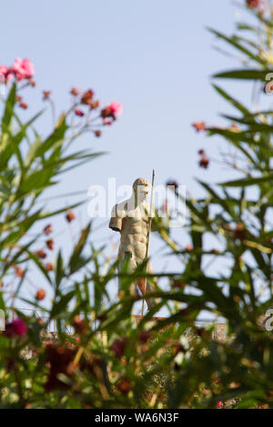 Obscured view of the bronze statue of Daedalus by Igor Mitoraj - a temporary installation at the archaeological site of ancient Pompeii Stock Photo