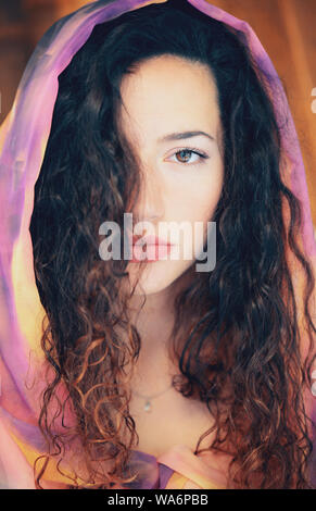 Beautiful Young Woman with pashmina over her head Stock Photo