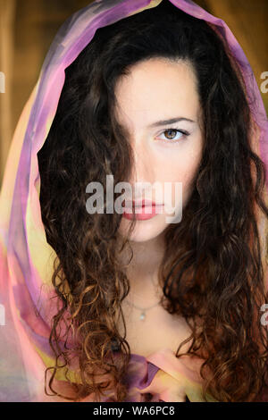 Beautiful Young Woman with pashmina over her head Stock Photo