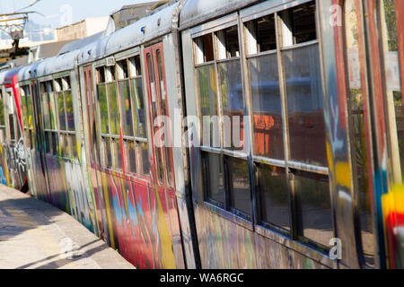 Graffiti on train pulling into Sant'Agnello station, Sorrento, Italy Stock Photo