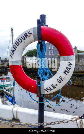 Ready-use emergency lifebelt on the harbour side at Castletown, Isle of Man Stock Photo