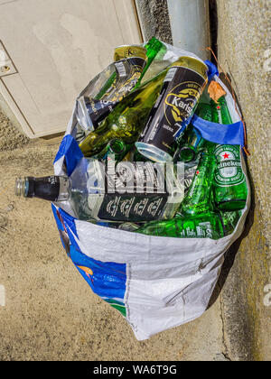 Plastic bag full of empty drinks bottles - France. Stock Photo