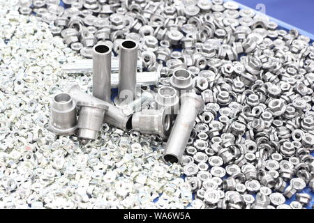 small bolts and nuts by manufacturing process ; tapping Stock Photo