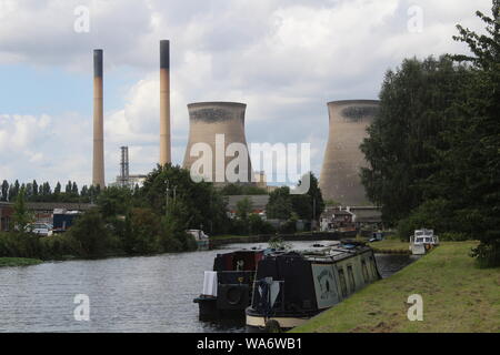 Narrow boats on canal with Ferrybridge Power Station in background Aire and Calder navigation Knottingley West Yorkshire Britain,UK Stock Photo
