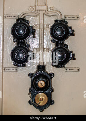The Helwick Light Vessel at dock in Swansea Marina. Old switches and wiring. Swansea, Wales, UK. Stock Photo