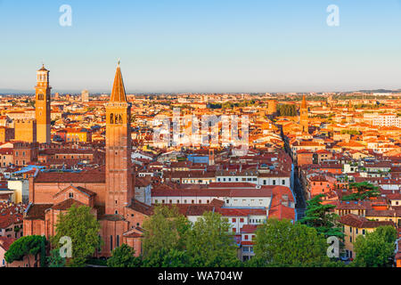 Beautiful view of Verona at sunrise. Old town with Saint Anastasia Church and Torre dei Lamberti or Lamberti Tower. Italy, Europe