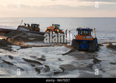 Sand sculpture works, Walcott, Norfolk, East Anglia, UK Stock Photo