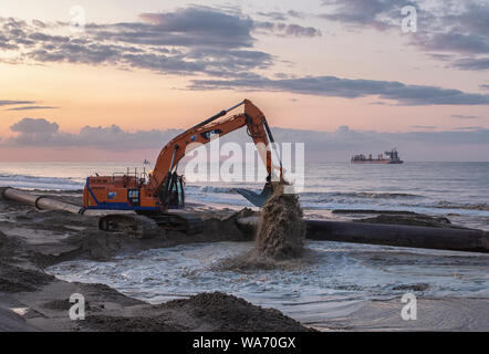 Sand sculpture works, Walcott, Norfolk, East Anglia, UK Stock Photo