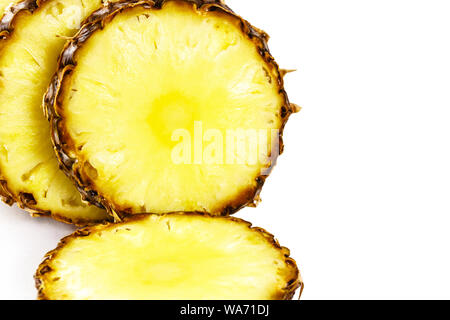 sliced ripe pineapple close up on white background Stock Photo