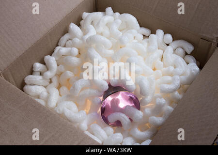 Crystal Glass Safely Packed in Box with Styrofoam Peanuts Stock Photo