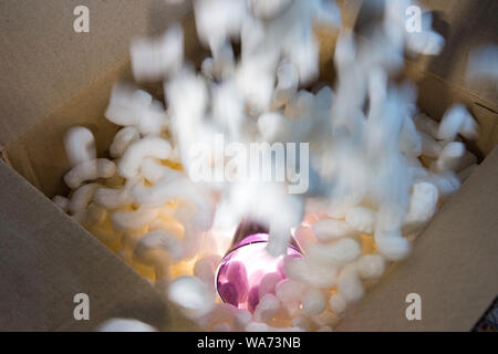 Crystal Glass Safely Packed in Box with Styrofoam Peanuts Stock Photo