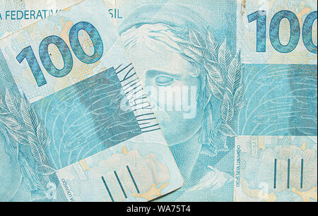 Brazilian real banknotes background. 100 reais brl. Brazilian money, real notes. Macro photo. Stock Photo