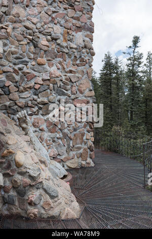 A  rocky, somewhat risky, twist and turn along a soaring tower of Bishop's Castle, a most eclectic art installation 9,000 feet high in the mountains of southern Colorado, up a winding road from San Isabel in San Isabel National Forest Stock Photo