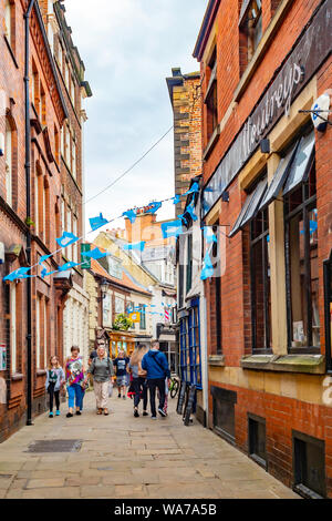 Grape Lane in Whitby Town Centre decorated with bunting of the Yorkshire Flag a white rose on a blue ground celebrating Yorkshire Day 1st August Stock Photo